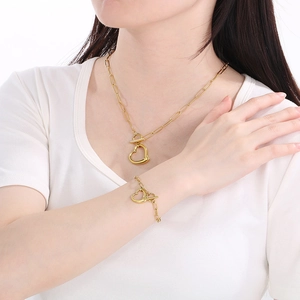 Chic gold titanium steel hollow heart pendant jewelry set with OT buckle chains