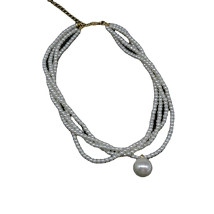 Elegant multi-layer pearl necklace with a large pendant and gold adjustable chain clasp