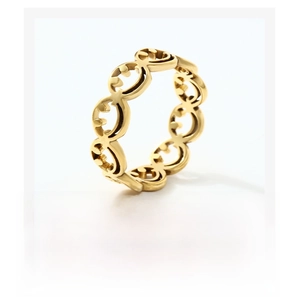 Detailed view of golden stainless steel hollow smiley face ring with marketing text background