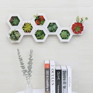 Modern white hexagonal wall planters with 7 assorted artificial succulent plant arrangements