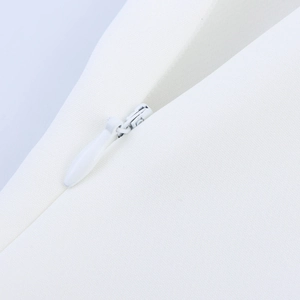 Detailed macro view of white textured fabric with high-quality invisible zipper closure
