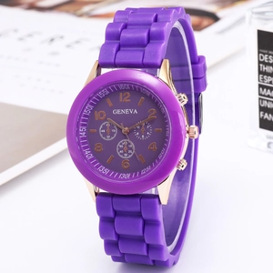 Detailed close-up of purple silicone strap and gold bezel on Geneva quartz watch