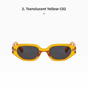 Detail of transparent yellow frame sunglasses with gray lenses and metal hinge joint