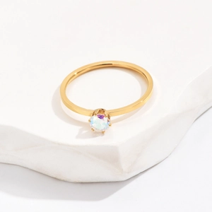 Minimalist 1mm gold titanium steel ring featuring a sparkling single solitaire cubic zirconia