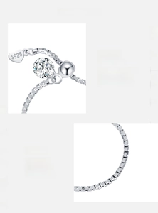Detail of adjustable S925 sterling silver moissanite bracelet with heart charm and D-color VVS1 stone