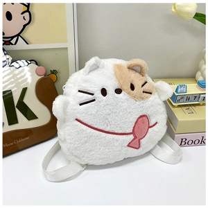 Detailed view of plush cat backpack featuring soft white faux fur and cute fish charm