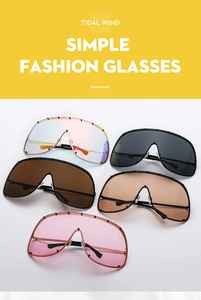 Detail of five assorted gradient lenses with sleek metal frames and rivet accents