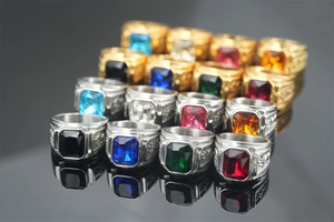 Detail of vintage dragon rings featuring square gemstones in multiple colors and relief work