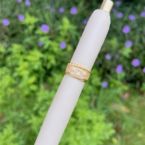 Detail of 18K gold-plated triple-layer adjustable ring with zircon and chain patterns