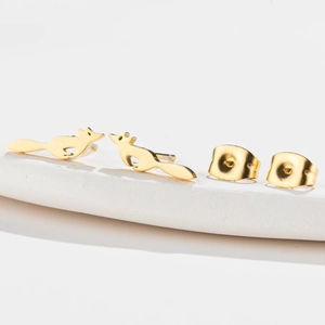 Charming golden running fox stud earrings for women with minimalist animal design