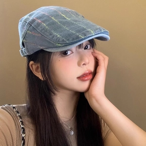 Detailed close-up of retro washed denim beret featuring colorful stitching and texture