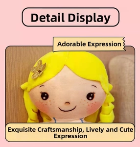 Close-up of embroidered facial details and yellow plush hair on a cute mermaid doll
