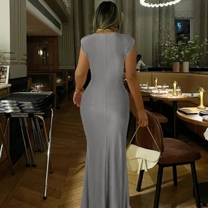 Detailed back view of a slim fit sleeveless grey maxi dress with elegant pleats