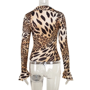 Back view of leopard print long sleeve top featuring flared cuffs and fitted waist design