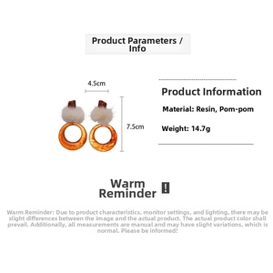 Detail view of retro resin hoop earrings with pompom, 4.5cm by 7.5cm size specifications