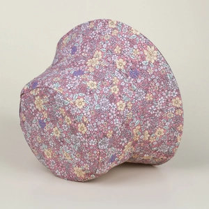 Close-up of pink floral bucket hat showing soft cotton texture and small flower print