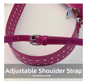 Detail of adjustable metallic pink shoulder strap with silver rivets and buckle