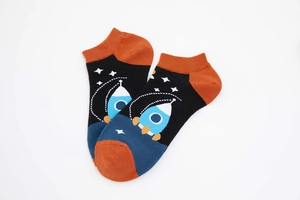 Close-up of astronaut rocket pattern on thick cotton ankle socks for men and women