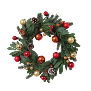 Christmas wreath with red and gold ornaments pine cones and green needles for front door decor