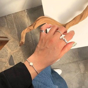 Minimalist 925 sterling silver knotted ring set with a sleek matching metal bangle