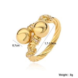 Detailed view of 18K gold plated twisted open ring with 0.7cm beads and cubic zirconia