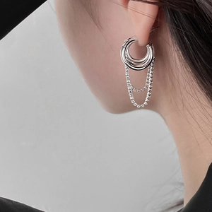 Silver multi-layer hoop earrings with cubic zirconia and fringe chains on female model
