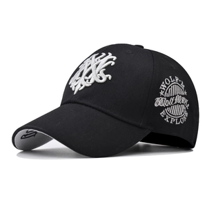 Detailed close-up of premium black baseball cap with white 3D embroidery and contrast brim
