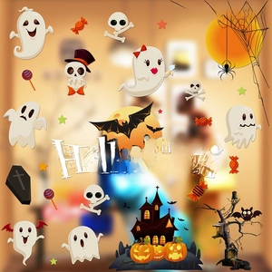 Detail of Halloween window clings featuring ghosts, pumpkins, and Happy Halloween text