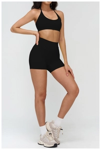 Close-up of black high-waisted gym shorts and sports bra set for women fitness wear