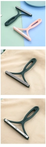 Dual-sided portable lint remover with silicone and grain brush heads for fabric care