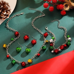 Detailed view of Christmas jewelry set with colorful bells, bracelet and earrings