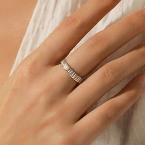 Minimalist s925 silver ring featuring a round moissanite and unique rippled band design
