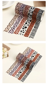 Detail of 6 animal print washi tape rolls featuring leopard, zebra and giraffe patterns