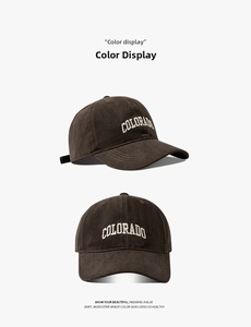 Detail view of coffee brown baseball cap with white COLORADO embroidery and washed cotton texture