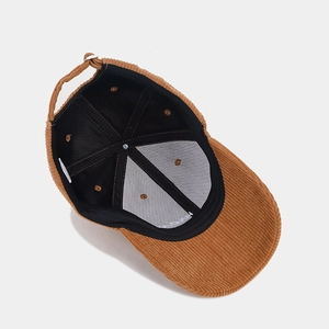 Inside view of brown corduroy baseball cap with mama embroidery and adjustable strap