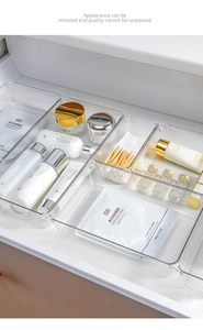 Detailed top view of clear PET organizers arranged in a drawer for cosmetics storage