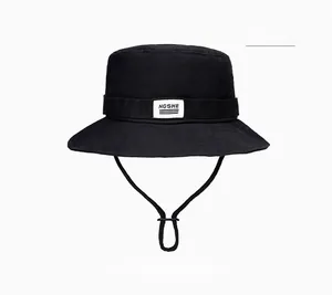 Close-up of black sun hat featuring adjustable drawstring and NGSHE brand label