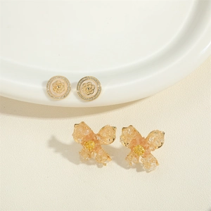 Elegant baroque pearl zircon earrings with gold camellia studs and crystal flower design