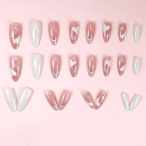 Pink and white almond press-on nails with heart patterns and French tips design