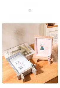 Close-up of a 6-inch wooden photo frame with a small easel stand and cute rabbit decor