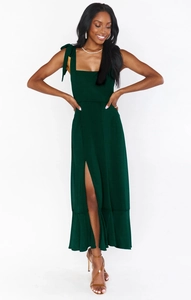 Elegant dark green maxi dress with shoulder ties, square neck, and side slit detail