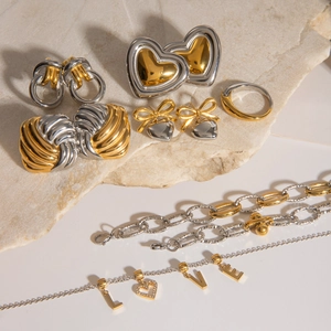 Mixed set of gold and silver stainless steel jewelry with heart and bow motifs