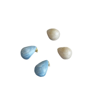 Pear-shaped teardrop enamel stud earrings in light blue and creamy white with gold plating