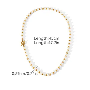 Detail of pearl necklace with gold metal beads, OT clasp and dimensions: 45cm length