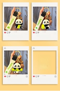 Close-up of cute panda resin keychain with bamboo and woven cream hand strap accessory