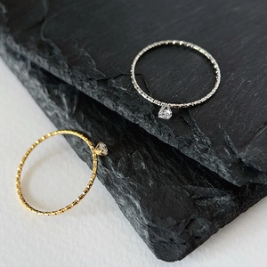 Sparkling 18k gold plated thin rings with tiny hanging gemstones in gold and silver