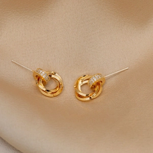 Elegant gold intertwined triple-loop stud earrings with sparkling pavé cubic zirconia
