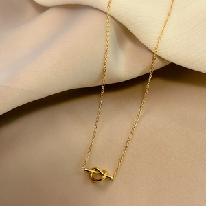 Minimalist gold knot pendant necklace for women in durable polished stainless steel