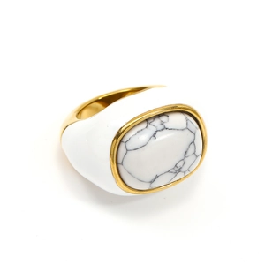 Detailed close-up of white enamel vintage ring with marble stone and 18k gold plating