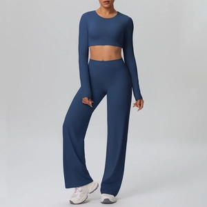Full view of navy blue yoga set featuring a crop top and high-waisted wide-leg pants
